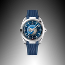 Luxury men's blue dial watch with world map, blue strap, and silver bezel on black background